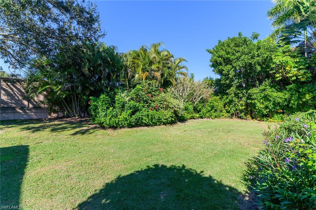 789 Coldstream Court Naples, FL 34104 - Photo 25 of 26 a view of a yard with an outdoor space