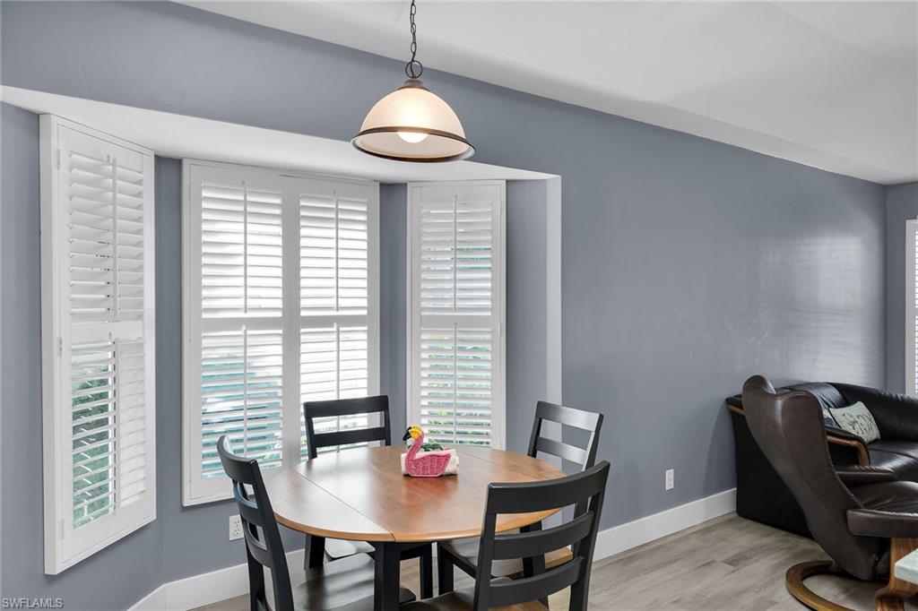 789 Coldstream Court Naples, FL 34104 - Photo 10 of 26 a view of a dining room with furniture window and outside view