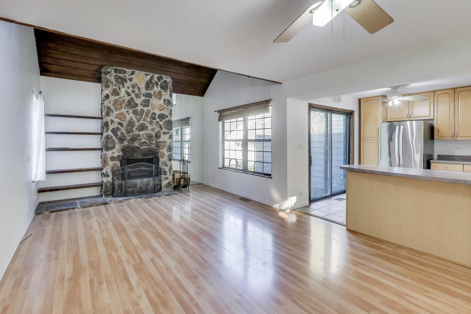 740 Chandler Road Gurnee, IL 60031 - Photo 4 of 26 wooden floor in an empty room with a window