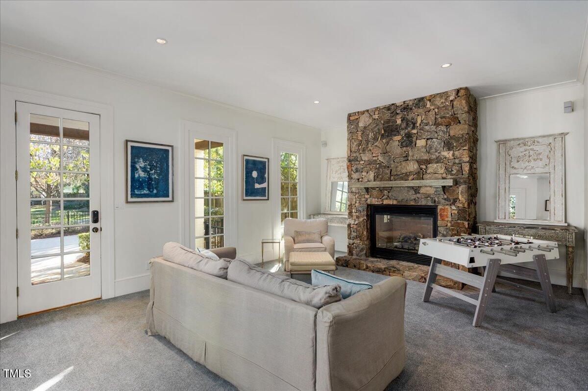 2412 Beechridge Road Raleigh, NC 27608 - Photo 12 of 39 a living room with furniture and a fireplace