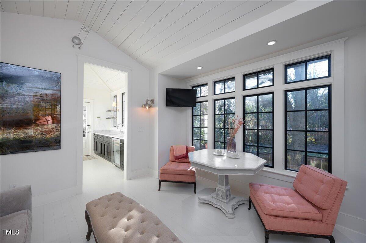 2412 Beechridge Road Raleigh, NC 27608 - Photo 25 of 39 a living room with furniture and a large window