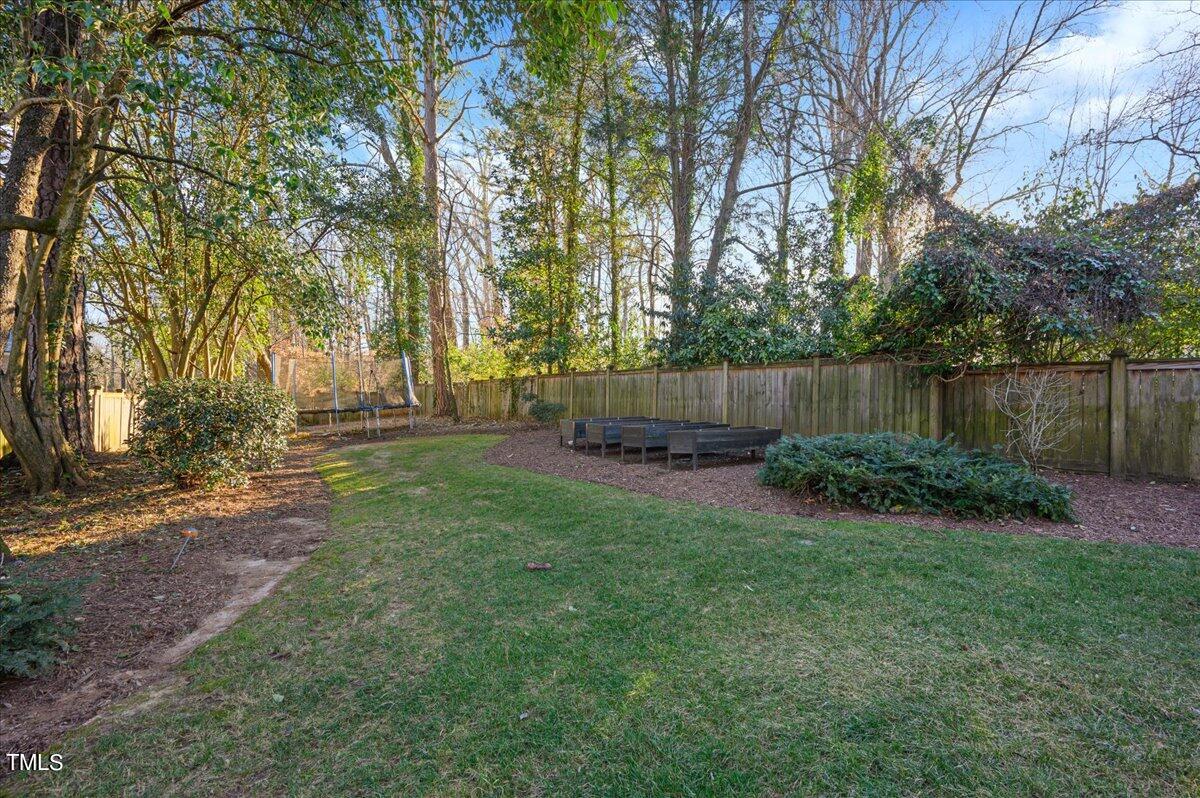 2412 Beechridge Road Raleigh, NC 27608 - Photo 27 of 39 a view of backyard with trampoline