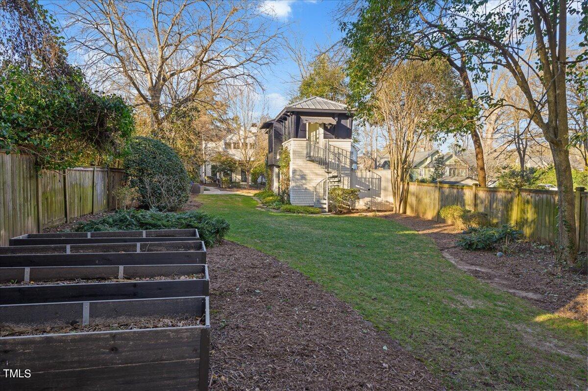 2412 Beechridge Road Raleigh, NC 27608 - Photo 28 of 39 a view of a house with a yard