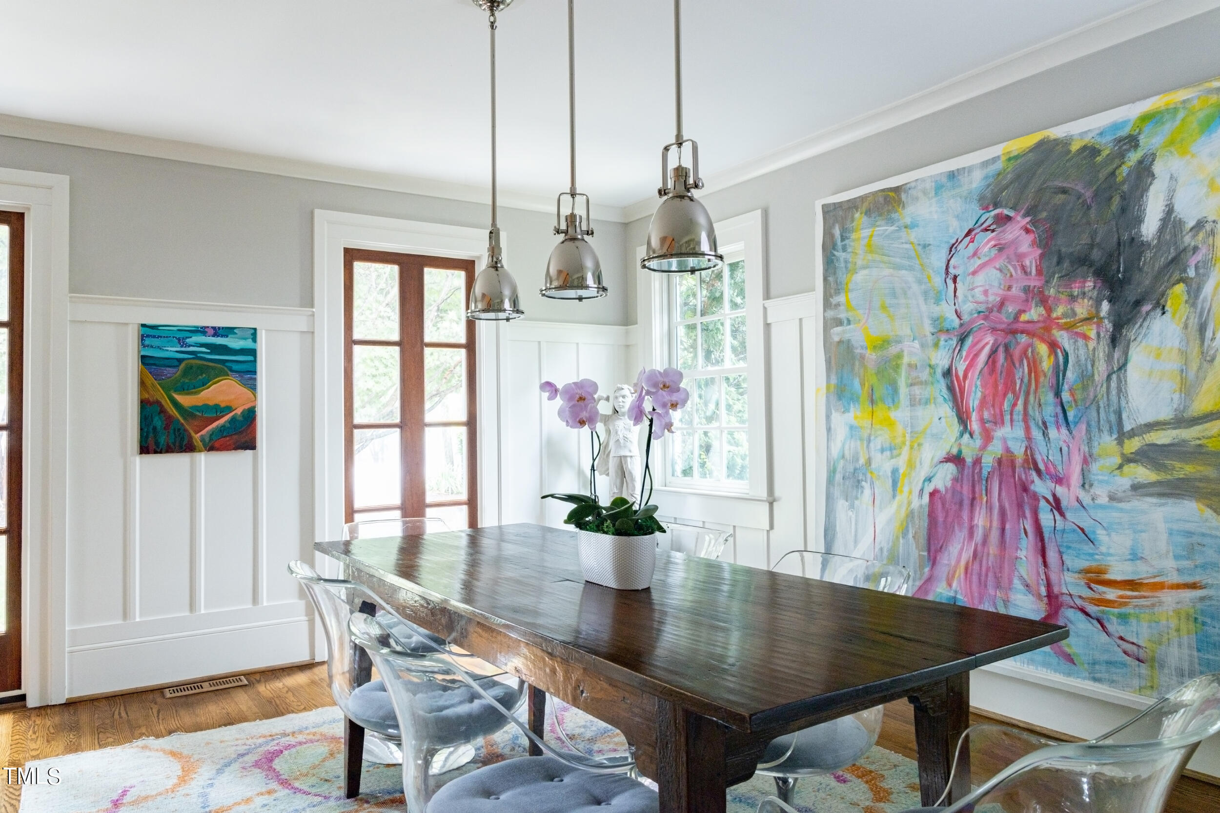 2412 Beechridge Road Raleigh, NC 27608 - Photo 5 of 39 a view of a dining room with furniture and wooden floor
