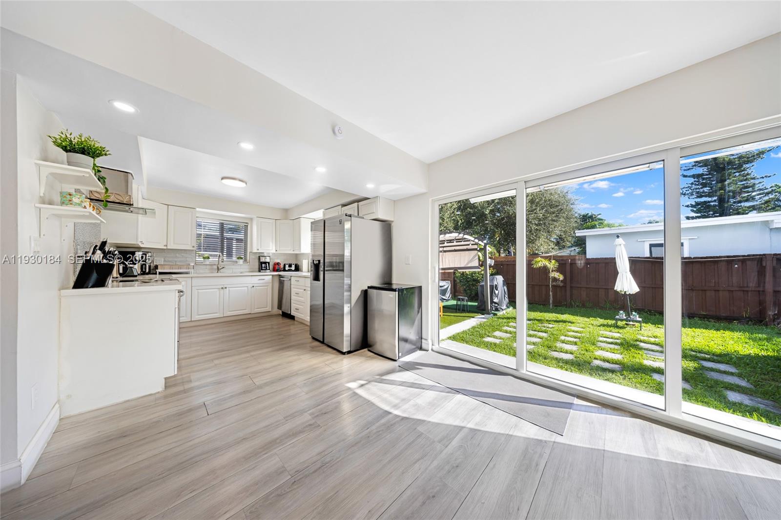 907 North Park Road Hollywood, FL 33021 - Photo 11 of 34 a view of kitchen with furniture and outdoor view