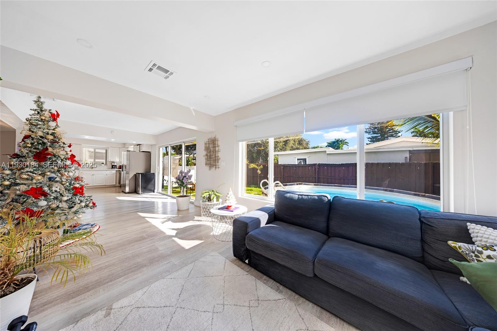 907 North Park Road Hollywood, FL 33021 - Photo 12 of 34 a living room with furniture and flowers