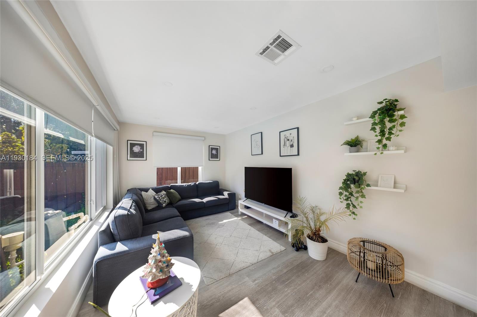 907 North Park Road Hollywood, FL 33021 - Photo 13 of 34 a living room with furniture and a flat screen tv