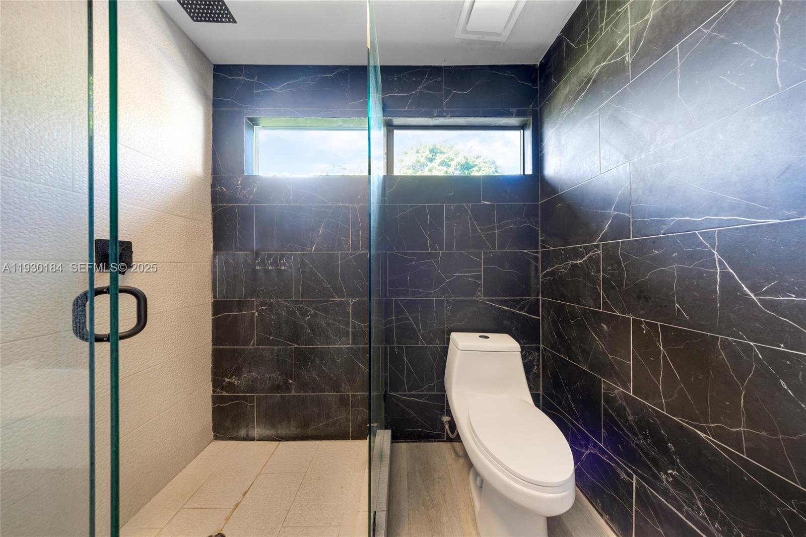 907 North Park Road Hollywood, FL 33021 - Photo 24 of 34 a bathroom with a toilet and a shower