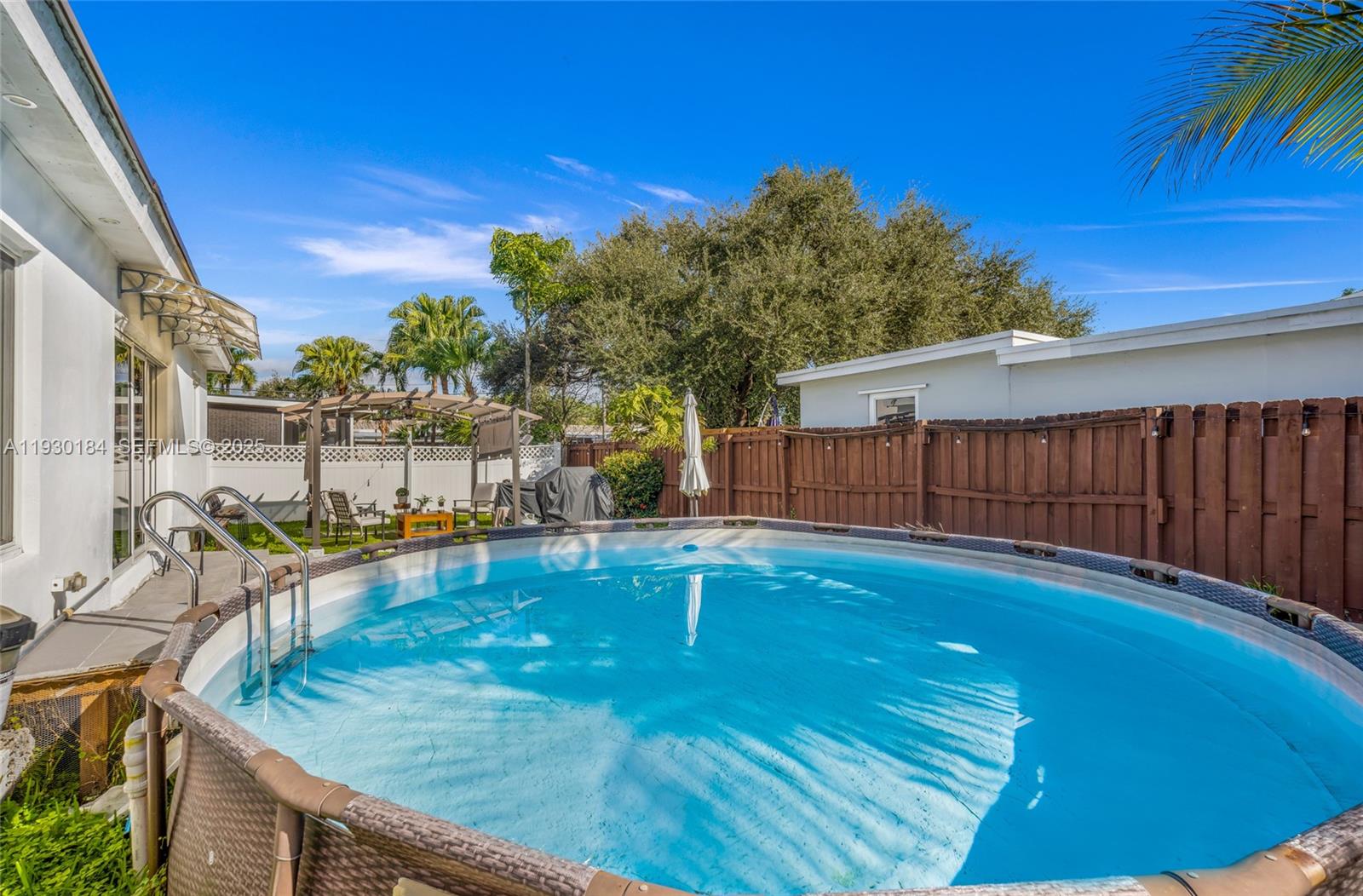 907 North Park Road Hollywood, FL 33021 - Photo 31 of 34 a view of a swimming pool with a patio