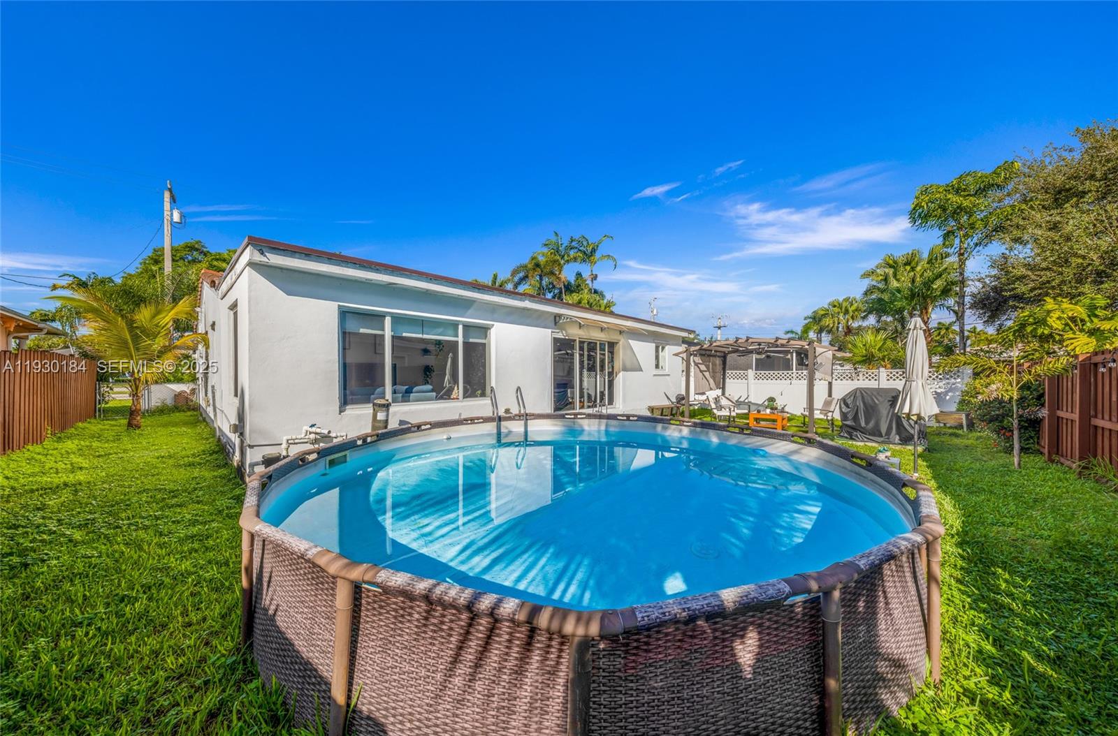 907 North Park Road Hollywood, FL 33021 - Photo 32 of 34 a view of a house with pool and chairs