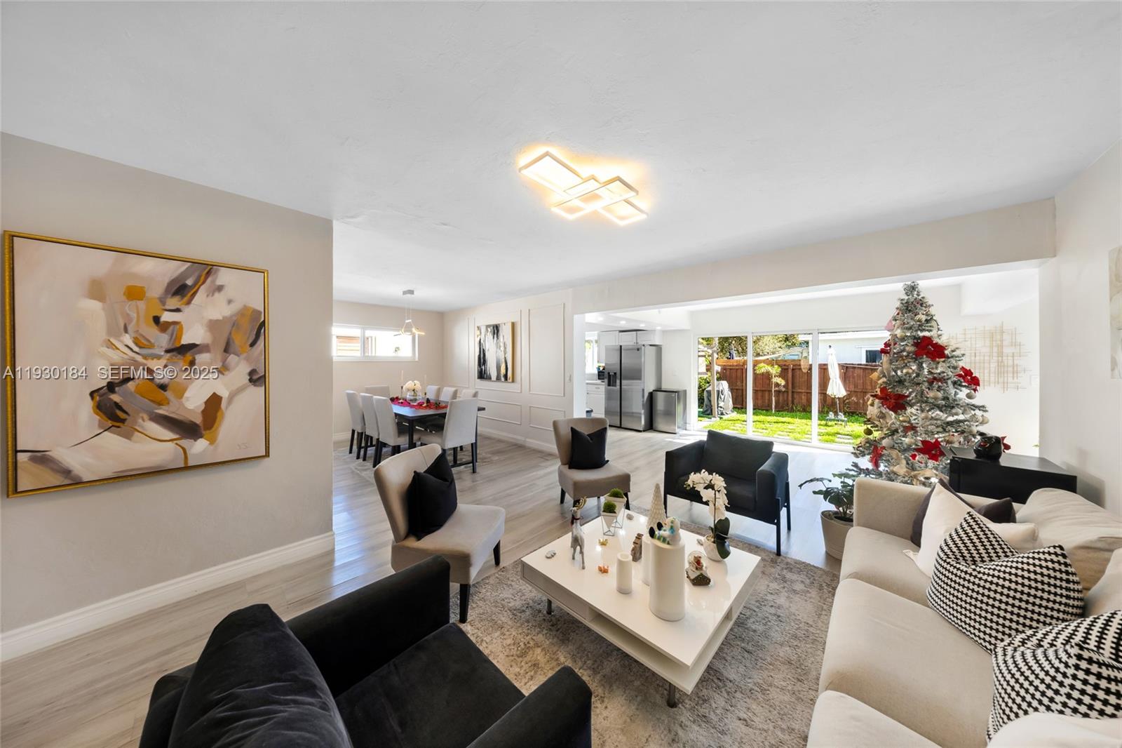 907 North Park Road Hollywood, FL 33021 - Photo 6 of 34 a living room with furniture and a large window