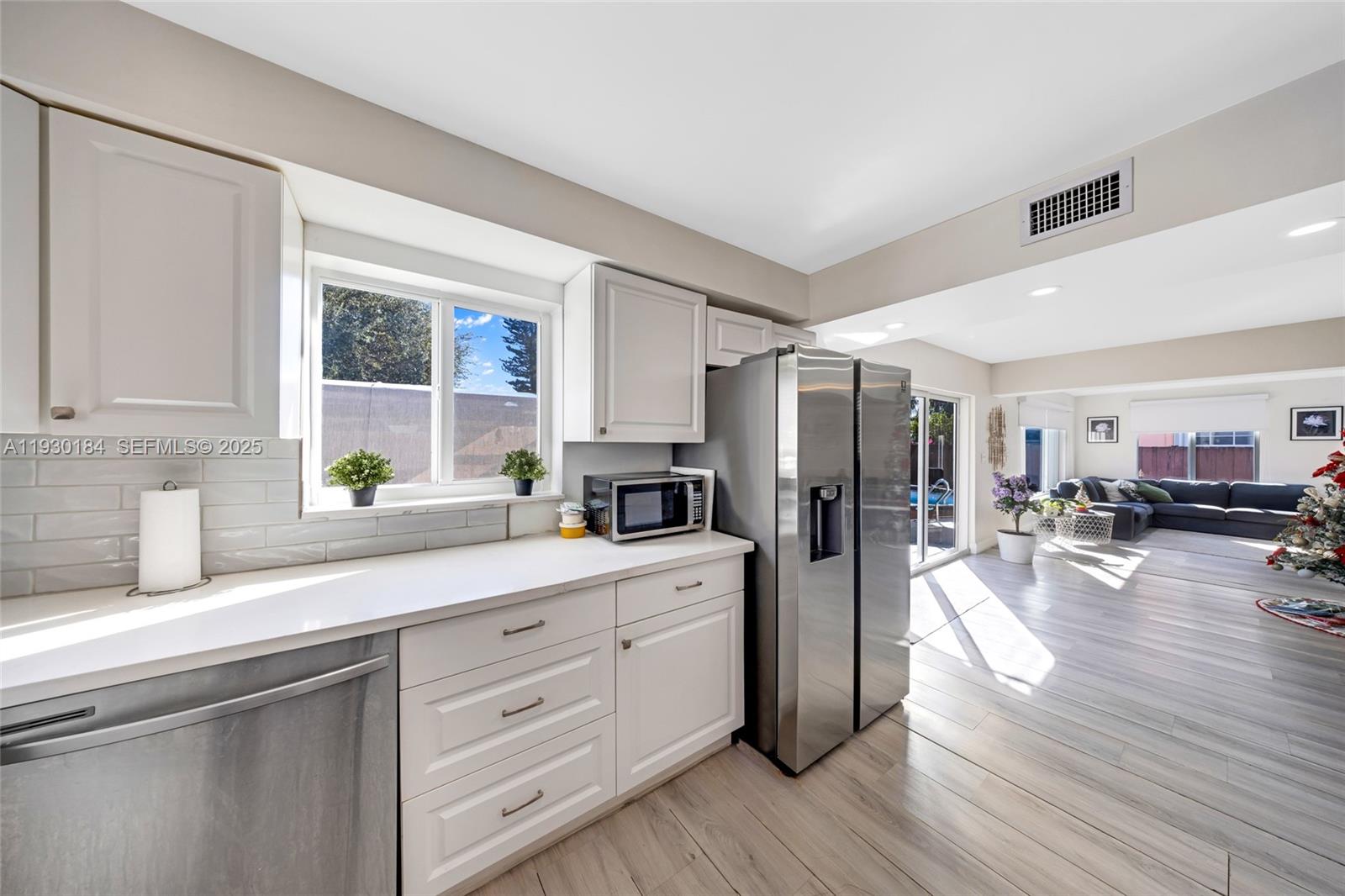 907 North Park Road Hollywood, FL 33021 - Photo 8 of 34 a kitchen with a refrigerator and a sink