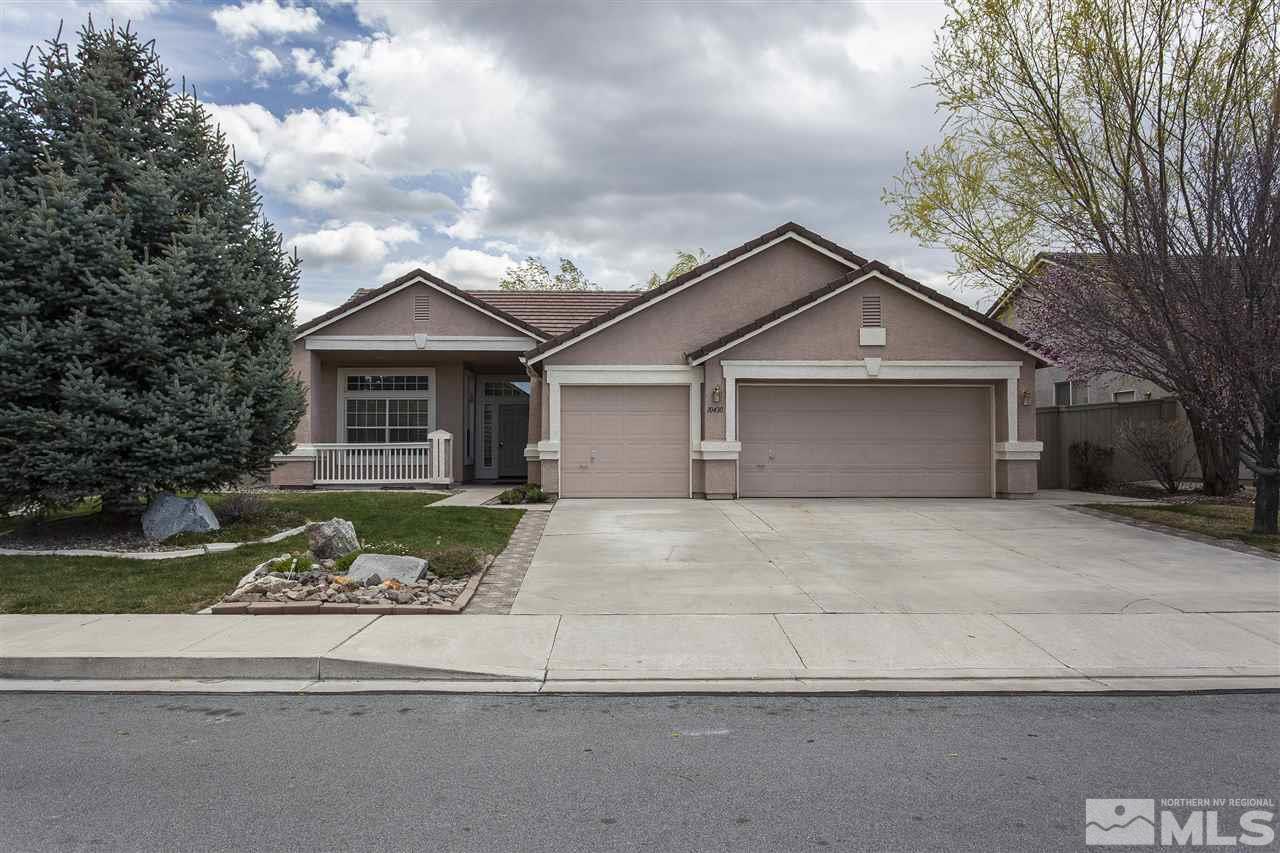 10430 Arbor Way Reno, NV 89521 - Photo 1 of 25 a front view of a house with a garden