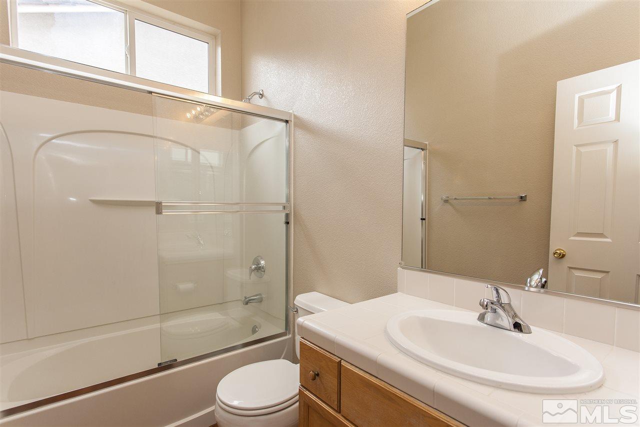 10430 Arbor Way Reno, NV 89521 - Photo 16 of 25 a bathroom with a sink toilet and shower