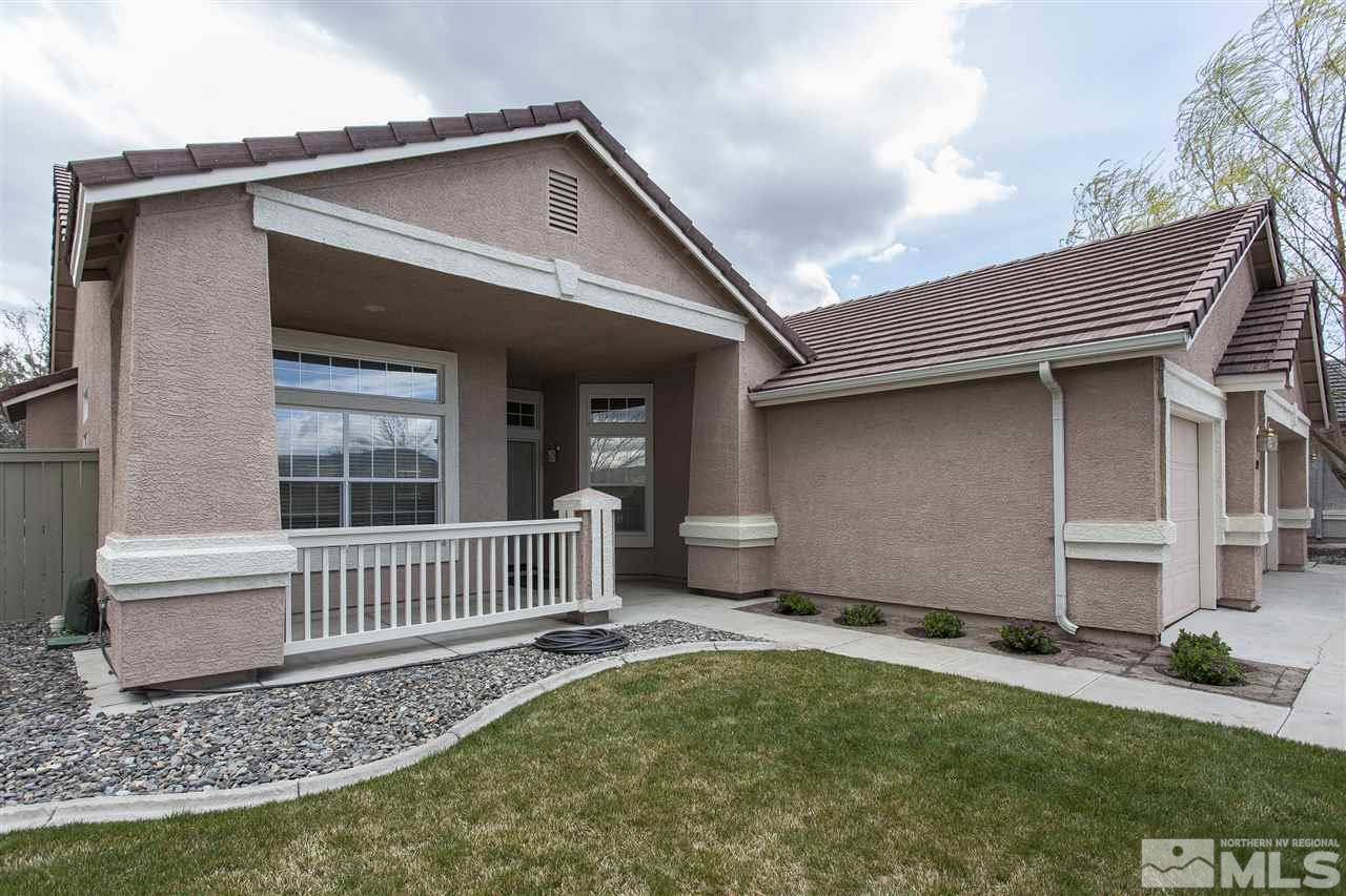 10430 Arbor Way Reno, NV 89521 - Photo 2 of 25 a view of a house with a small yard and wooden fence