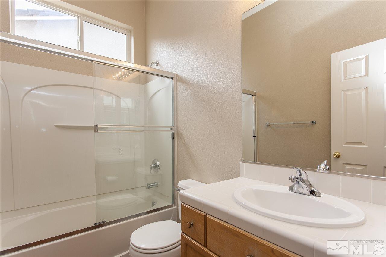 10430 Arbor Way Reno, NV 89521 - Photo 22 of 25 a bathroom with a sink toilet and shower