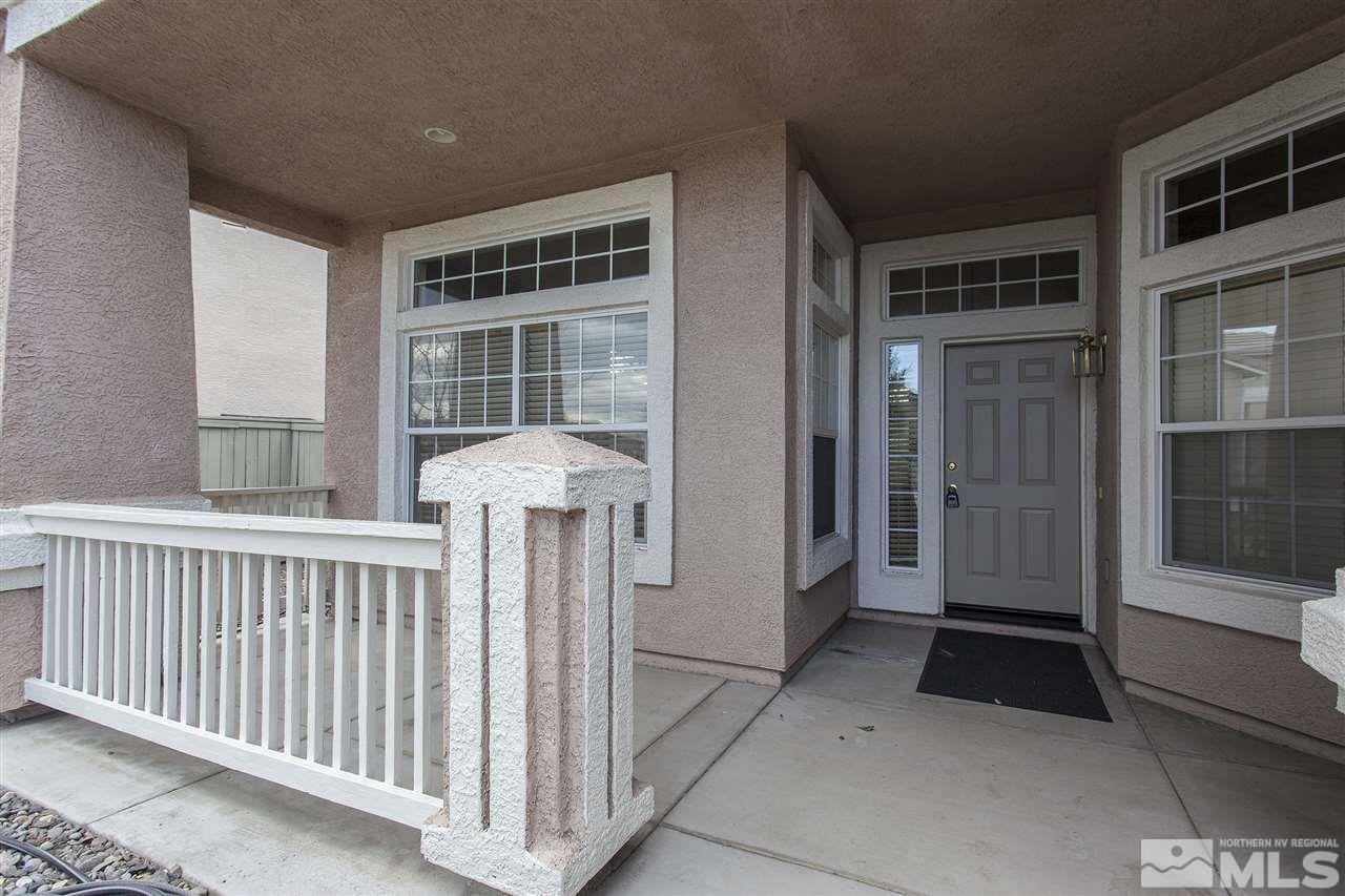 10430 Arbor Way Reno, NV 89521 - Photo 3 of 25 a view of a porch with a table and chairs