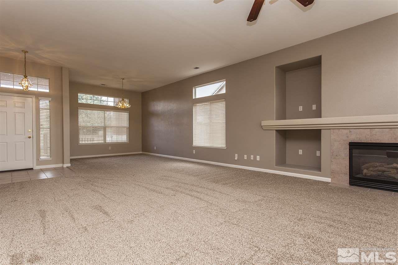 10430 Arbor Way Reno, NV 89521 - Photo 8 of 25 a view of an empty room with window and fireplace