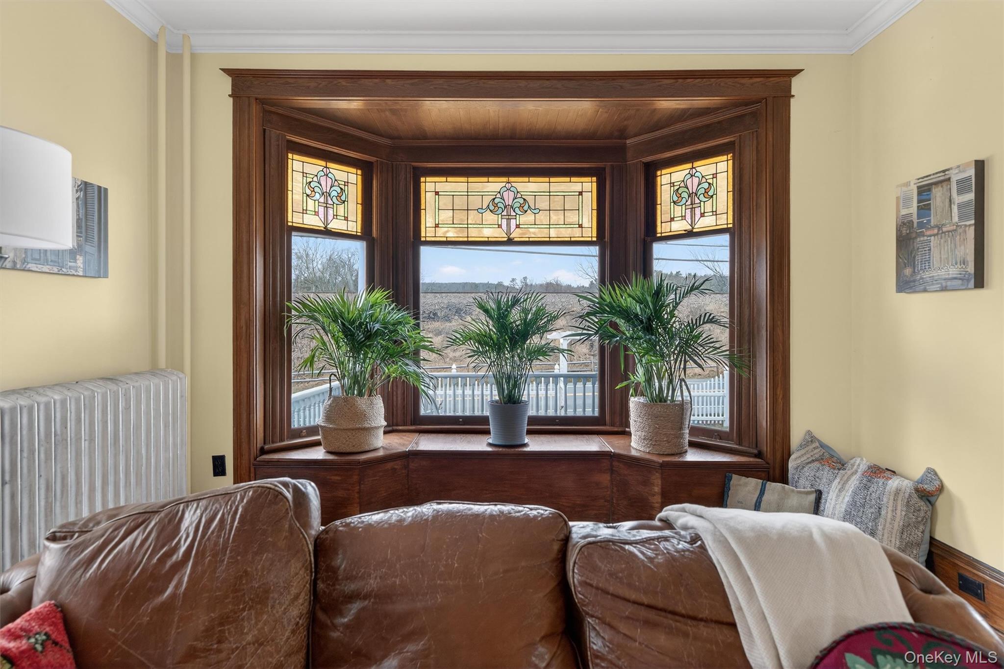 48 Kirks Road Narrowsburg, NY 12764 - Photo 5 of 50 a living room with a large window and potted plants