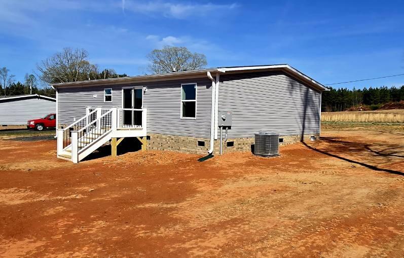 5450 Axton Road Axton, VA 24054 - Photo 15 of 20 a backyard of a house with barbeque oven and outdoor seating