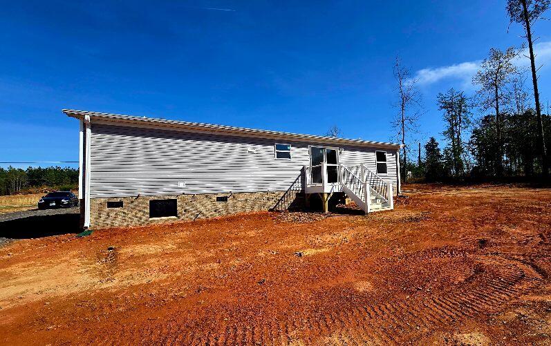 5450 Axton Road Axton, VA 24054 - Photo 16 of 20 a view of a house with a patio