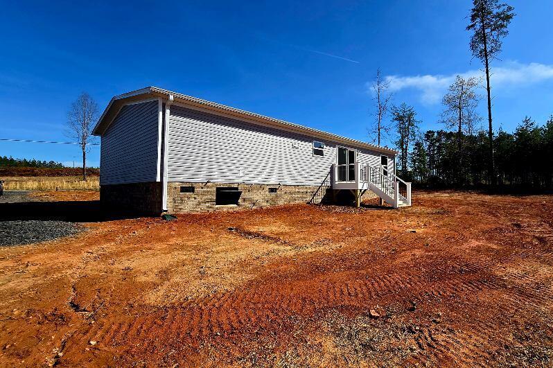 5450 Axton Road Axton, VA 24054 - Photo 17 of 20 a view of a house with a yard