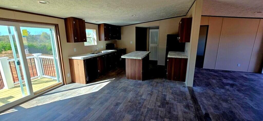 5450 Axton Road Axton, VA 24054 - Photo 5 of 20 a kitchen with stainless steel appliances granite countertop a refrigerator and a sink