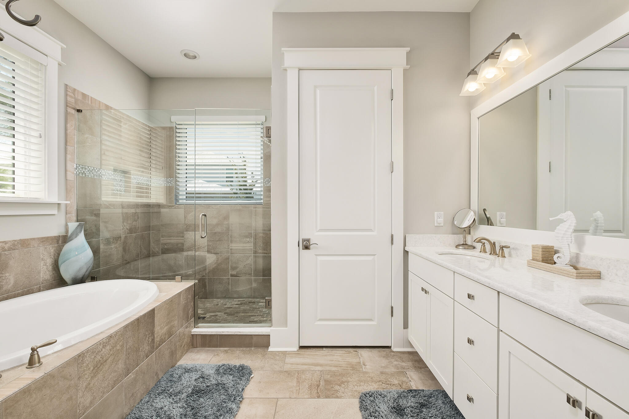 442 Flatwoods Forest Loop Santa Rosa Beach, FL 32459 - Photo 14 of 46 a bathroom with a double vanity sink a toilet a mirror and shower