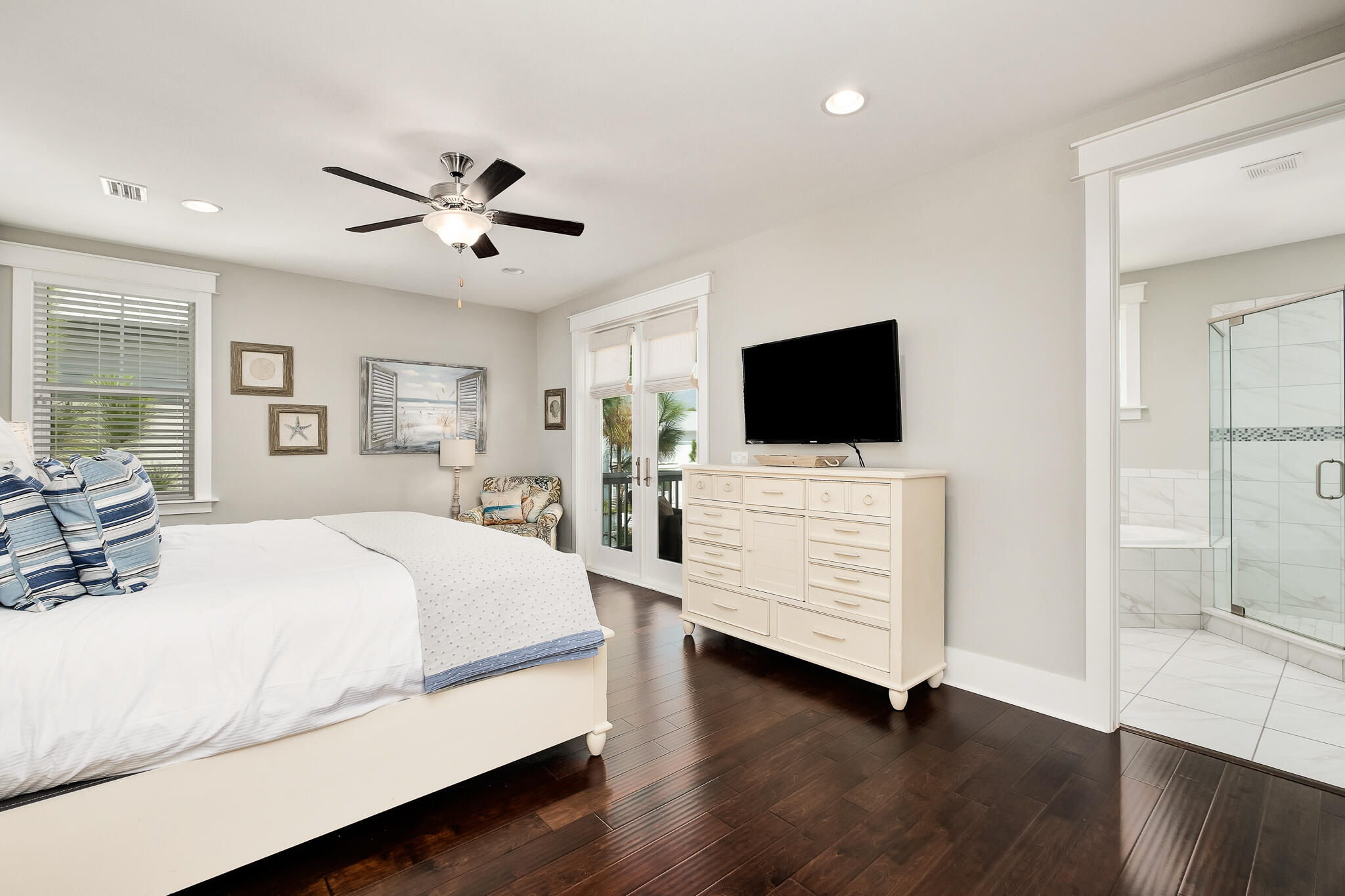 442 Flatwoods Forest Loop Santa Rosa Beach, FL 32459 - Photo 19 of 46 a bedroom with a bed tv and wooden floor