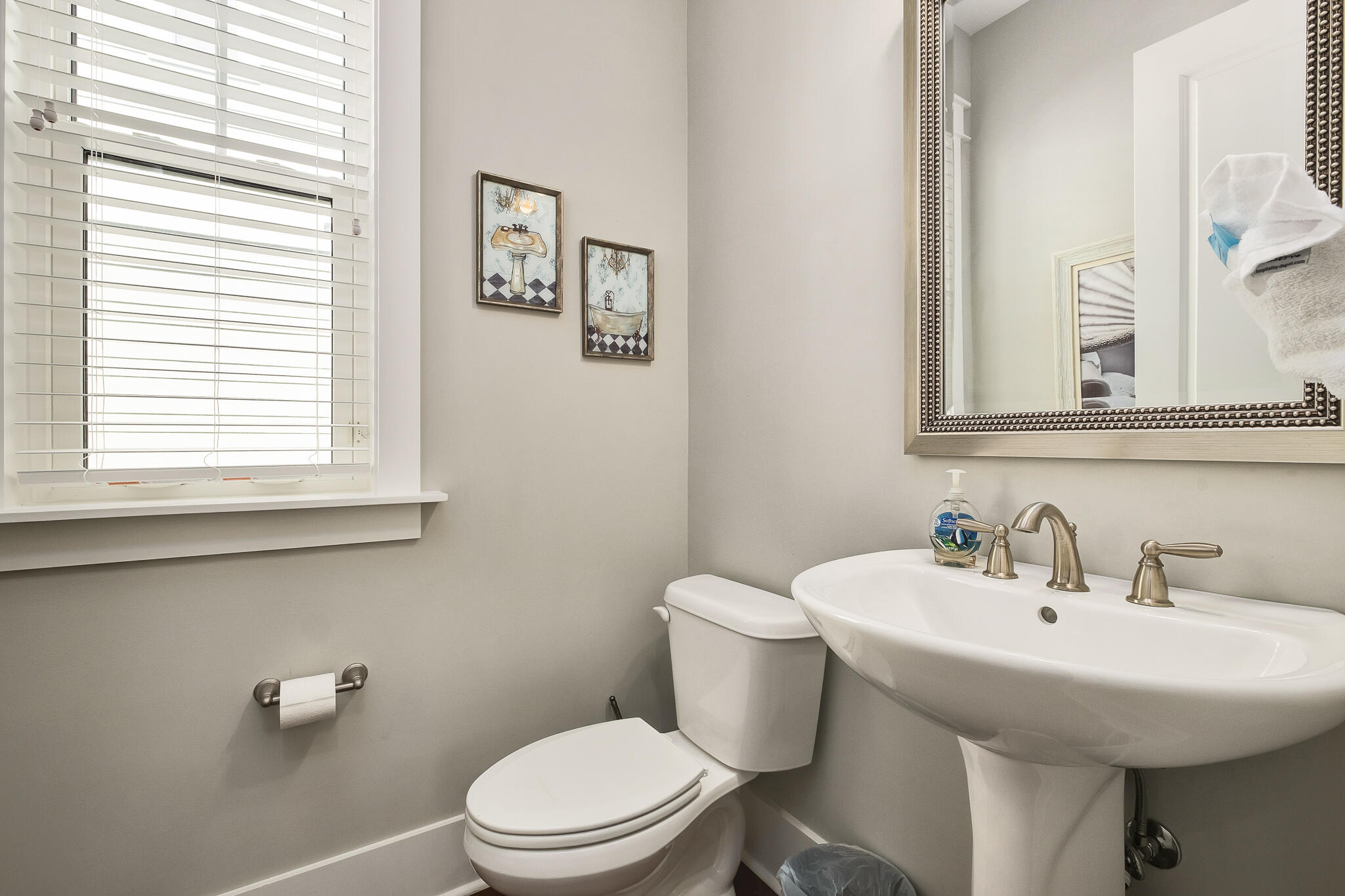 442 Flatwoods Forest Loop Santa Rosa Beach, FL 32459 - Photo 27 of 46 a bathroom with a toilet a sink and a window