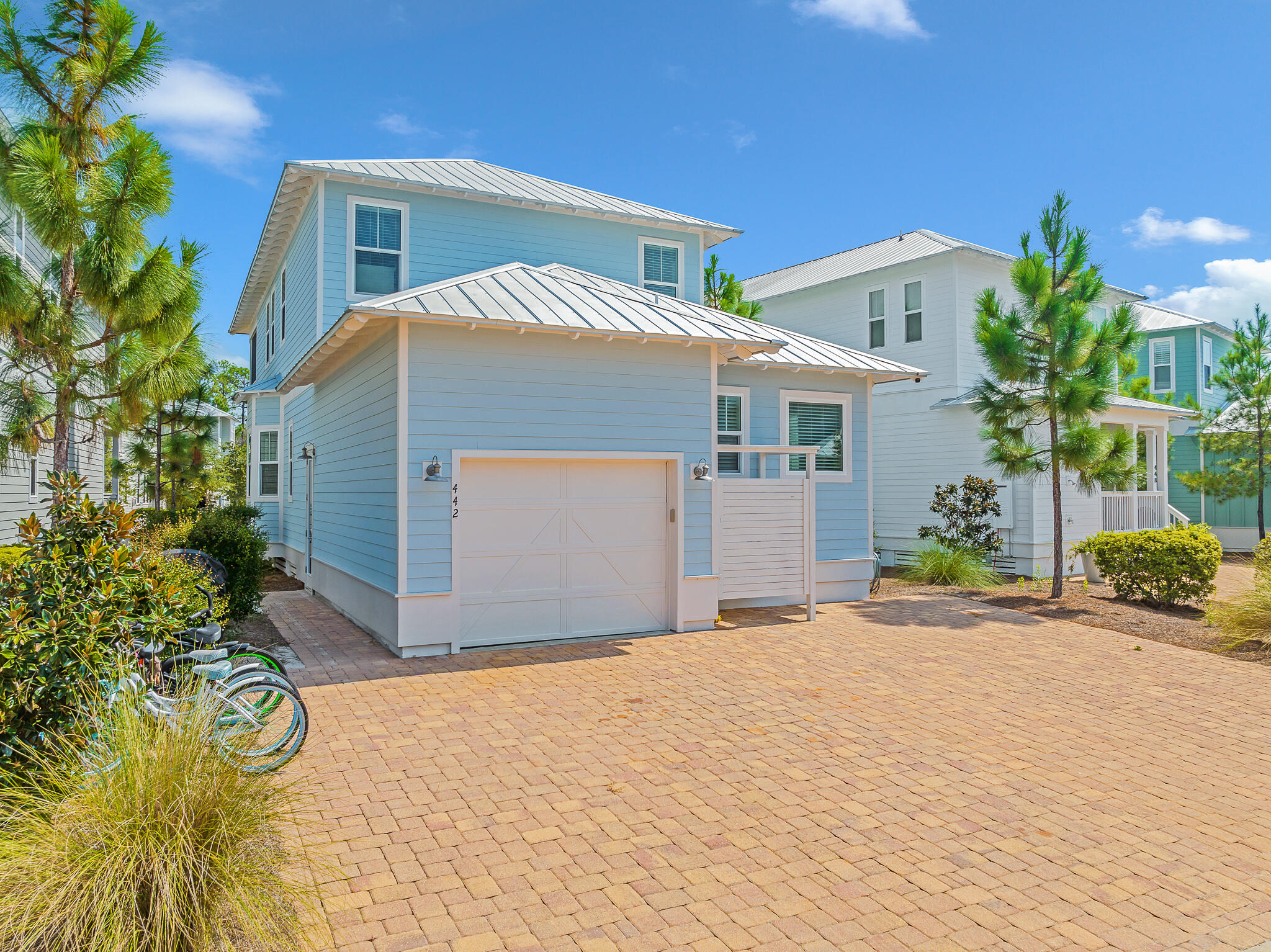 442 Flatwoods Forest Loop Santa Rosa Beach, FL 32459 - Photo 29 of 46 a front view of a house with a yard and garage