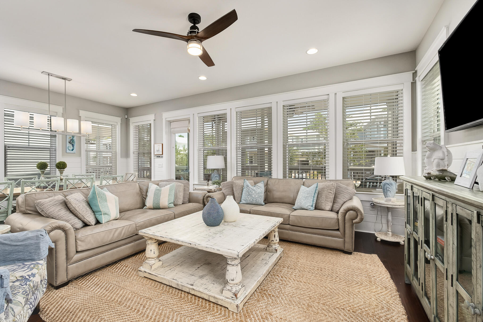 442 Flatwoods Forest Loop Santa Rosa Beach, FL 32459 - Photo 7 of 46 a living room with furniture a flat screen tv and a large window