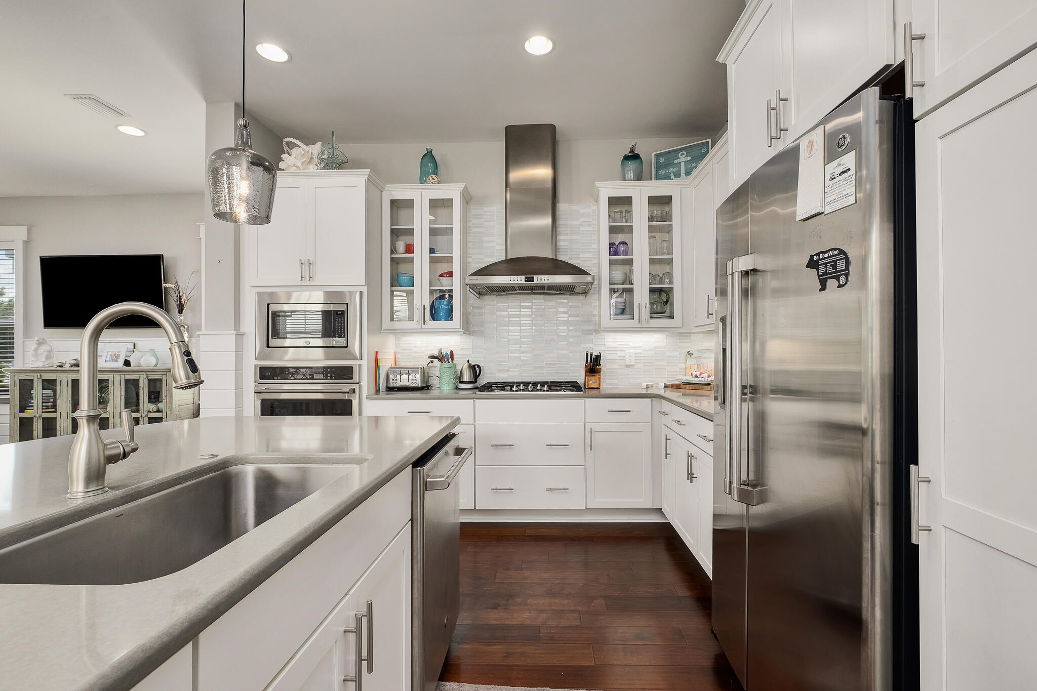 442 Flatwoods Forest Loop Santa Rosa Beach, FL 32459 - Photo 9 of 46 a kitchen with stainless steel appliances cabinets a sink and a stove