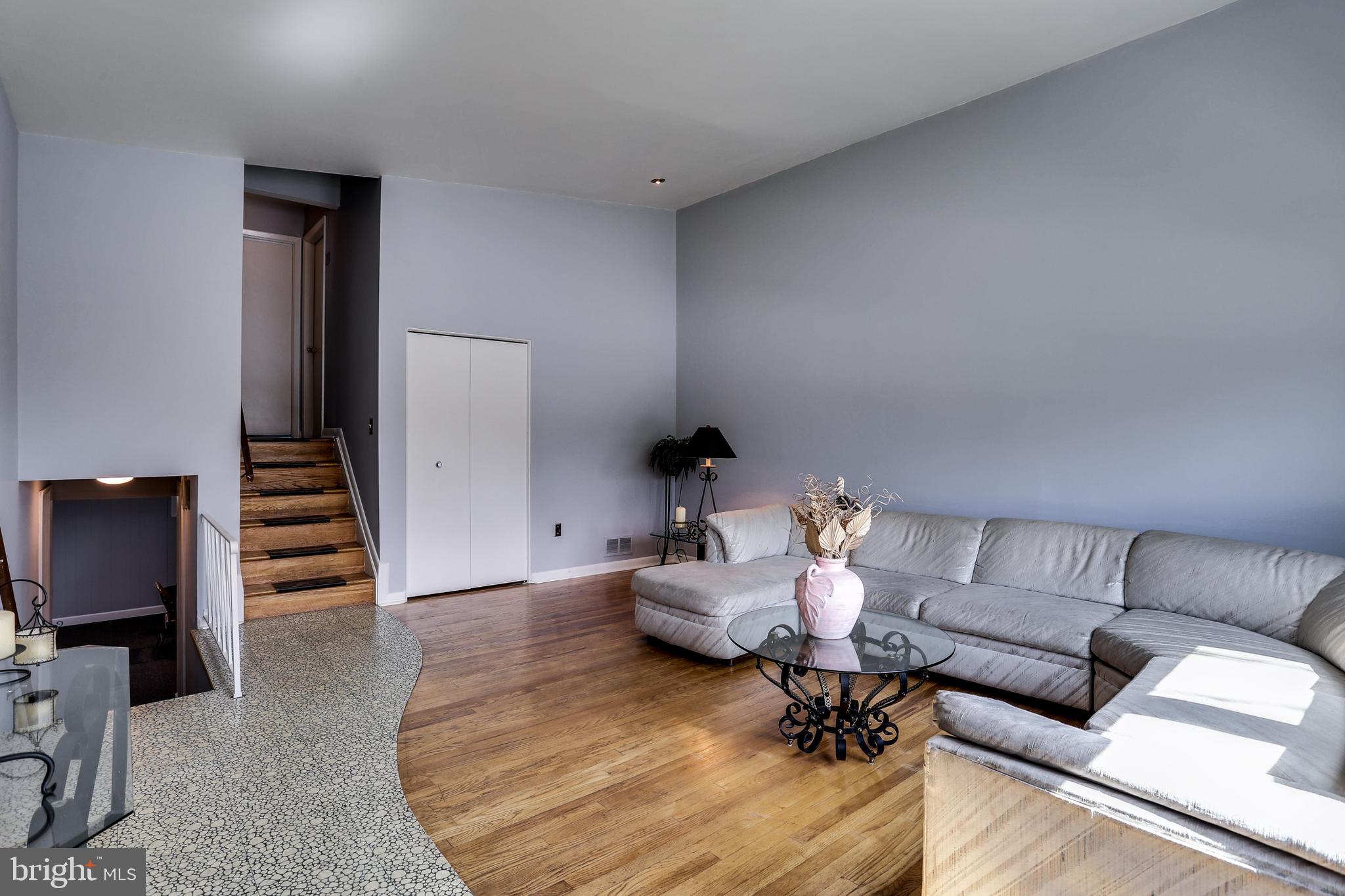 4602 Old Court Road Baltimore, MD 21208 - Photo 5 of 24 View of living room with access to upper level