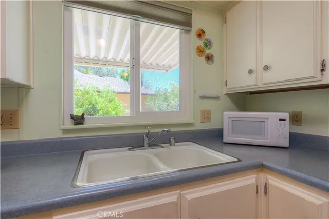 a bathroom with a sink and a window