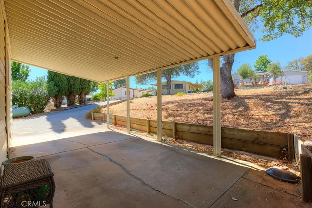 a backyard of a house with outdoor seating