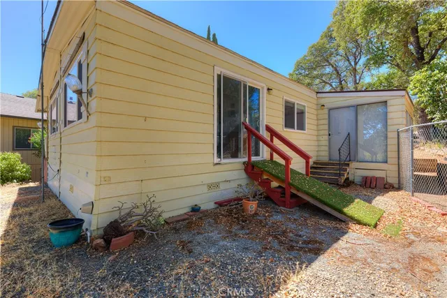a view of a wooden door in the backyard