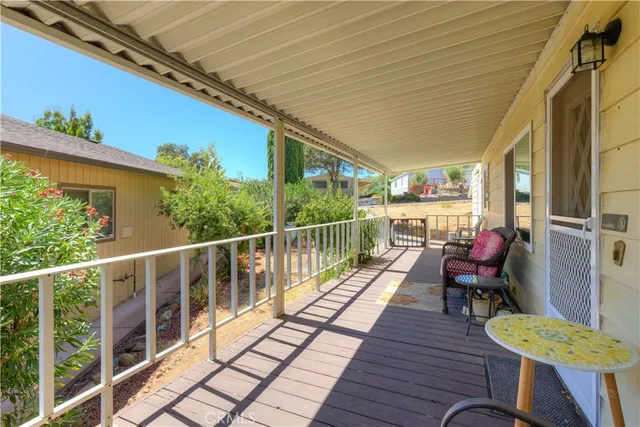 a view of a balcony with chairs