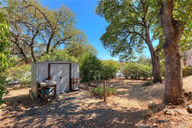 a front view of a house with a yard covered in snow