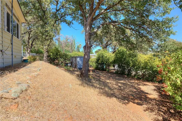 a view of a backyard of a house