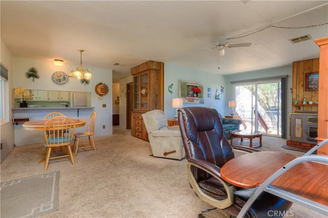 a view of a livingroom with furniture window and wooden floor