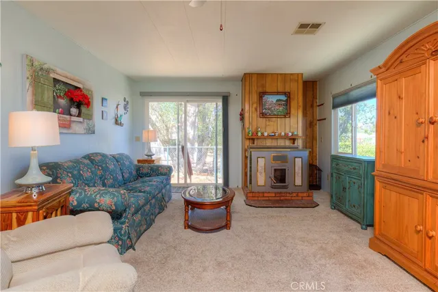 a living room with furniture and a gate