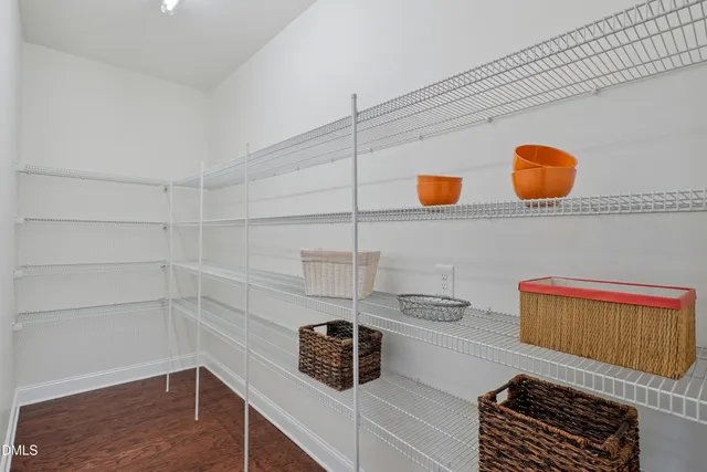 a bedroom with a bed and ceiling fan