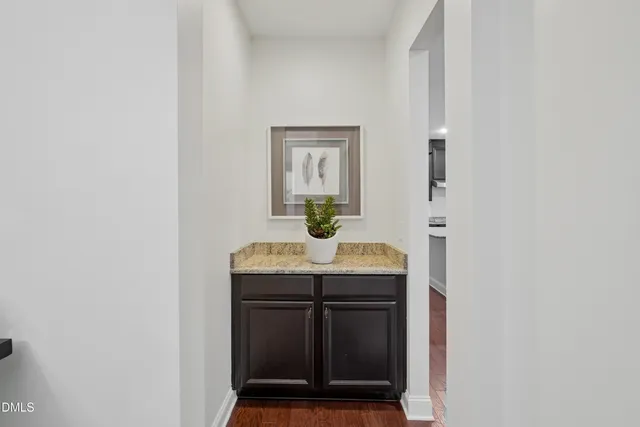 a view of walk in closet with clothes