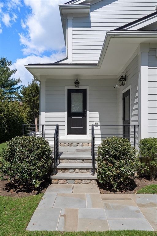 7 Massasoit Road Wellesley, MA 02481 - Photo 39 of 42 a front view of a house with a yard
