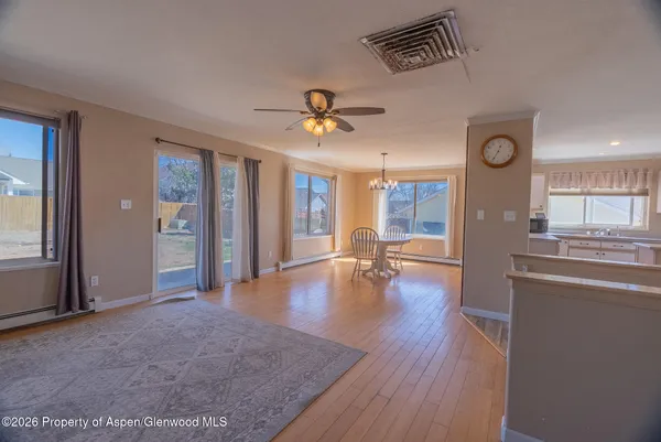 a view of livingroom with hardwood floor and a ceiling fan