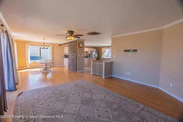 a view of a livingroom with wooden floor