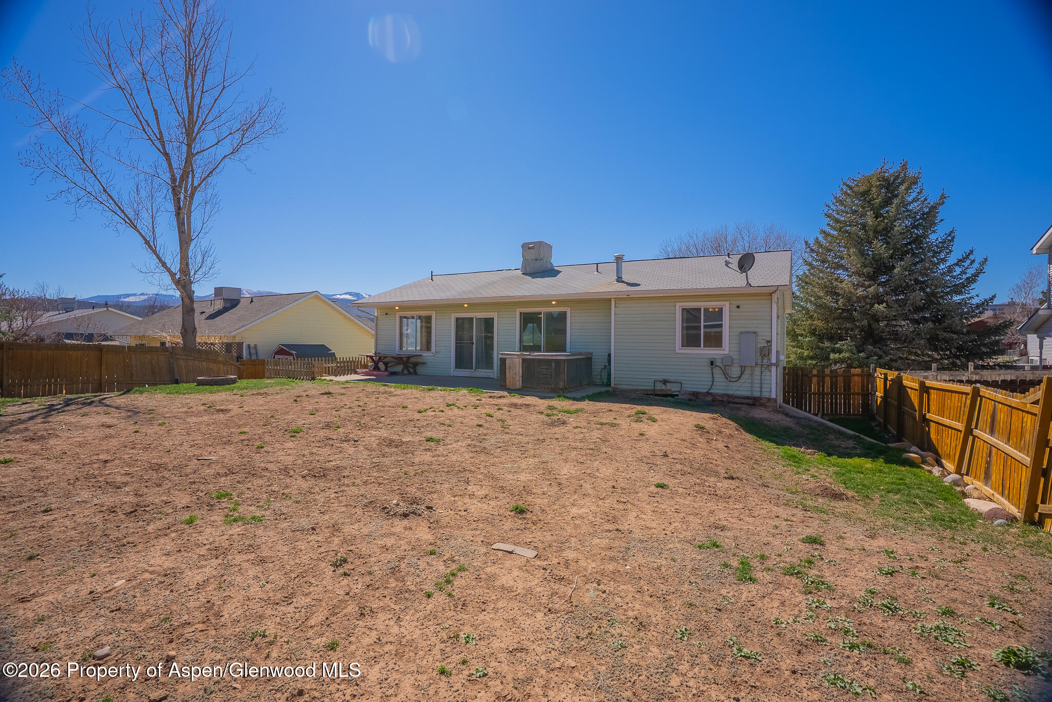 1558 East 12th Street Rifle, CO 81650 - Photo 21 of 25 a front view of a house with a yard