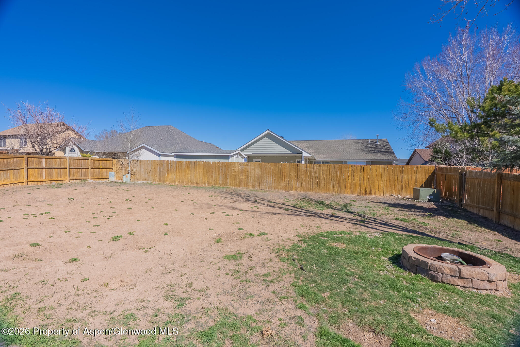 1558 East 12th Street Rifle, CO 81650 - Photo 22 of 25 a view of a house with a yard