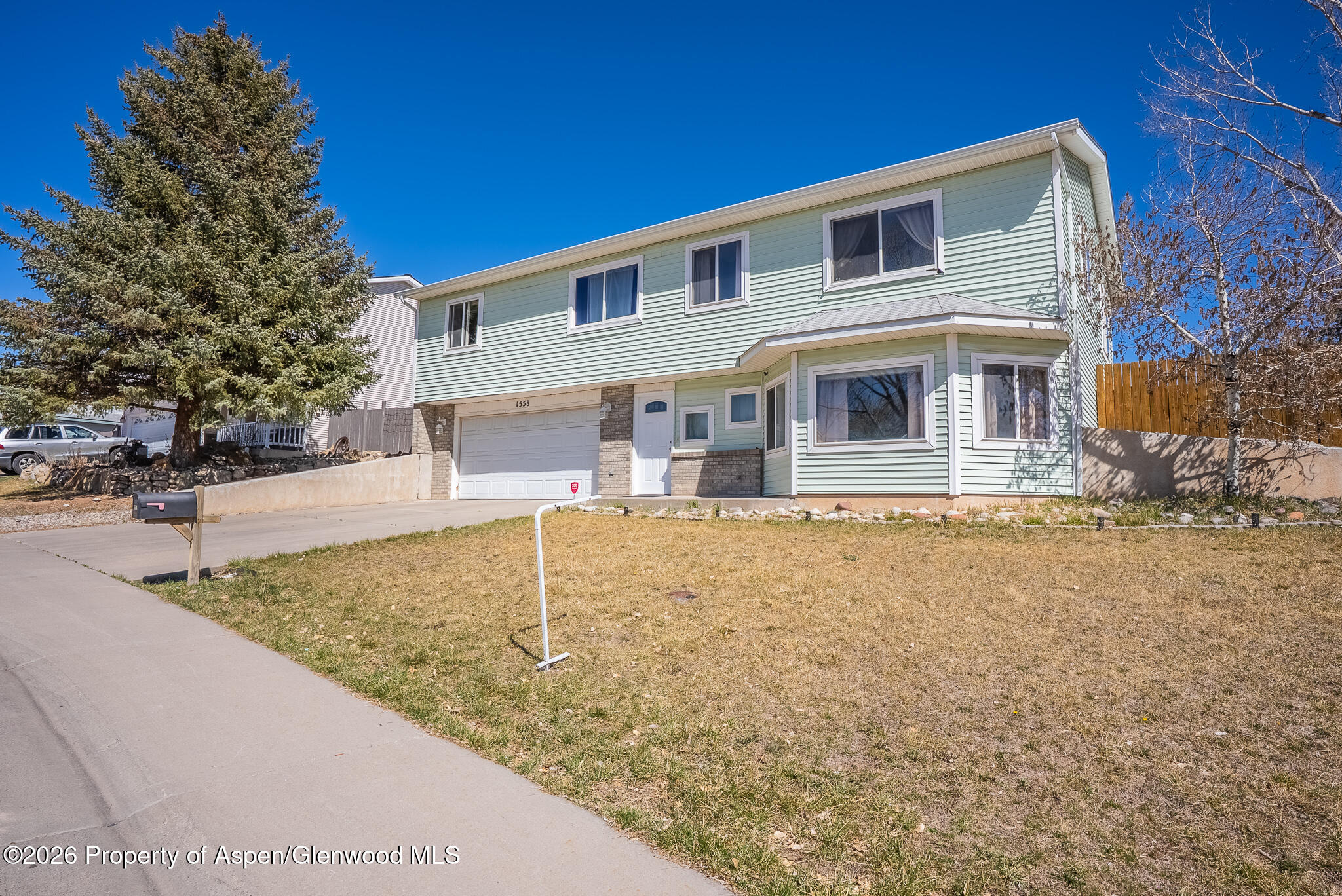 1558 East 12th Street Rifle, CO 81650 - Photo 25 of 25 front view of a house with a yard